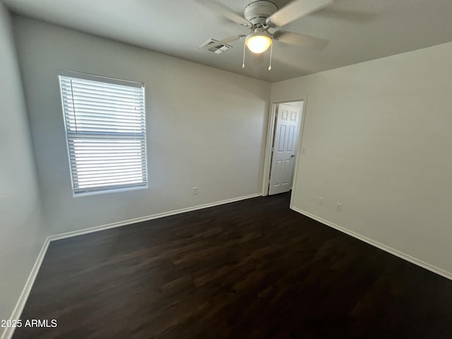 30944 N Bramwell Ave, San Tan Valley, AZ 85143 - empty room featuring baseboards, visible vents, ceiling fan, and dark wood-type flooring
