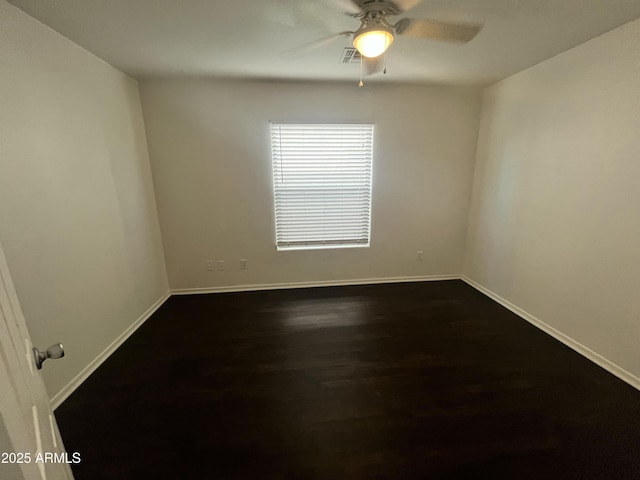 30944 N Bramwell Ave, San Tan Valley, AZ 85143 - empty room with ceiling fan, dark wood finished floors, baseboards, and visible vents