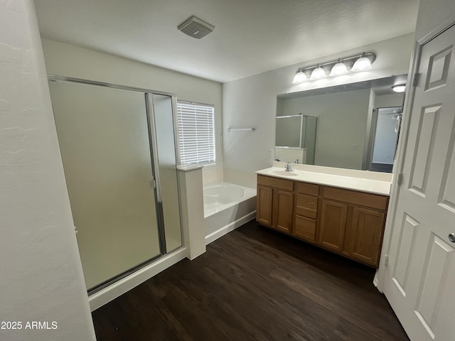 30944 N Bramwell Ave, San Tan Valley, AZ 85143 - bathroom with a bath, a shower stall, vanity, and wood finished floors