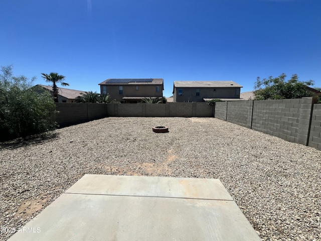 30944 N Bramwell Ave, San Tan Valley, AZ 85143 - view of yard with a fenced backyard, a patio area, and an outdoor fire pit