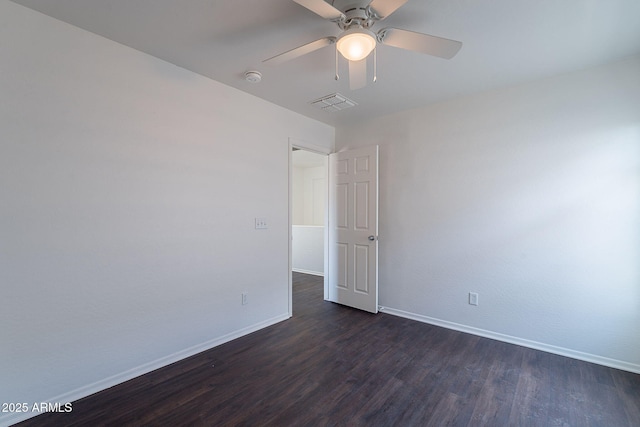 30944 N Bramwell Ave, San Tan Valley, AZ 85143 - empty room featuring baseboards, a ceiling fan, dark wood finished floors, and visible vents