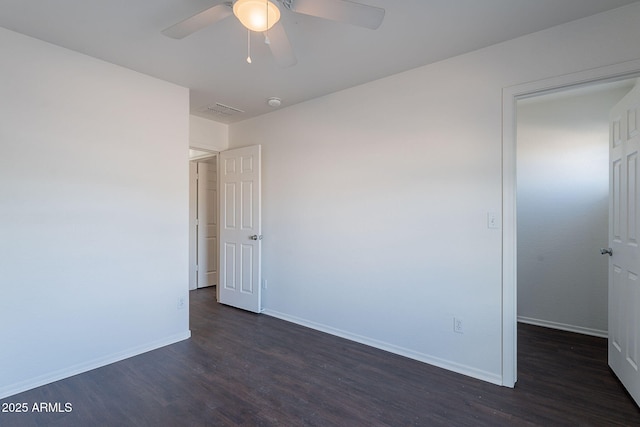 30944 N Bramwell Ave, San Tan Valley, AZ 85143 - empty room featuring a ceiling fan, baseboards, dark wood finished floors, and visible vents