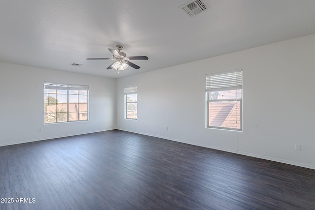 30944 N Bramwell Ave, San Tan Valley, AZ 85143 - unfurnished room featuring dark wood-style flooring, baseboards, visible vents, and a ceiling fan