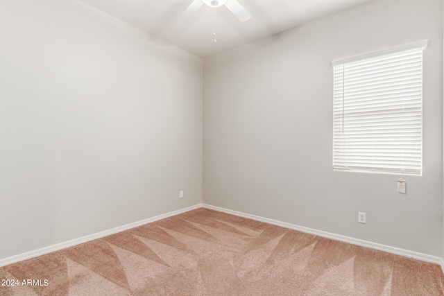 unfurnished room featuring carpet flooring, ceiling fan, and plenty of natural light