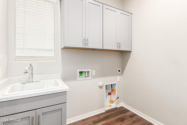 washroom with dark hardwood / wood-style floors, sink, electric dryer hookup, hookup for a gas dryer, and hookup for a washing machine