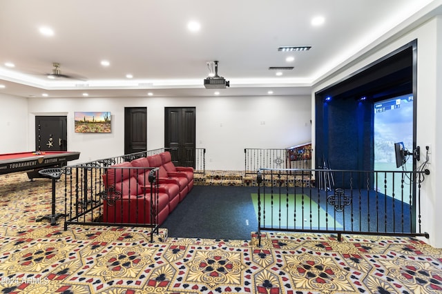 cinema room featuring a raised ceiling, billiards, ceiling fan, and carpet flooring