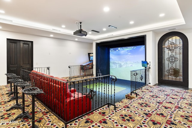 home theater room featuring a tray ceiling