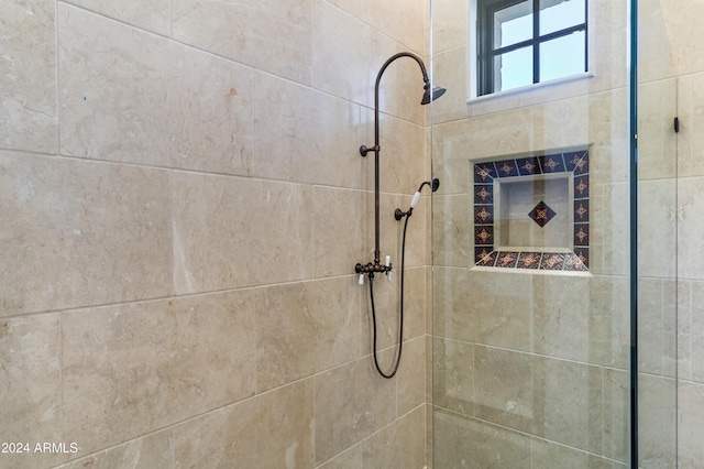 bathroom with tiled shower