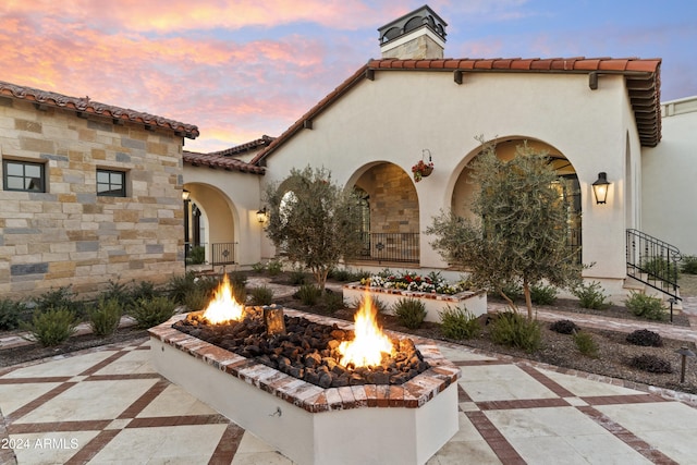 exterior space with an outdoor fire pit