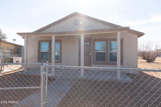 349 E Central Ave, Coolidge, AZ 85128 - view of front of house with stucco siding and fence