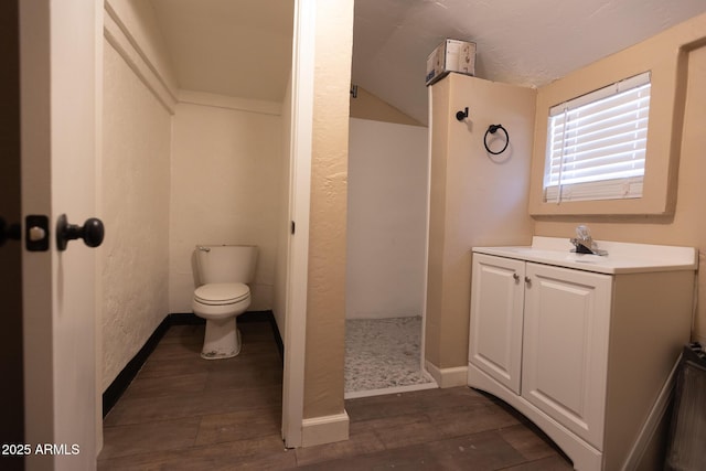 349 E Central Ave, Coolidge, AZ 85128 - bathroom with vanity, a walk in shower, toilet, and wood finished floors