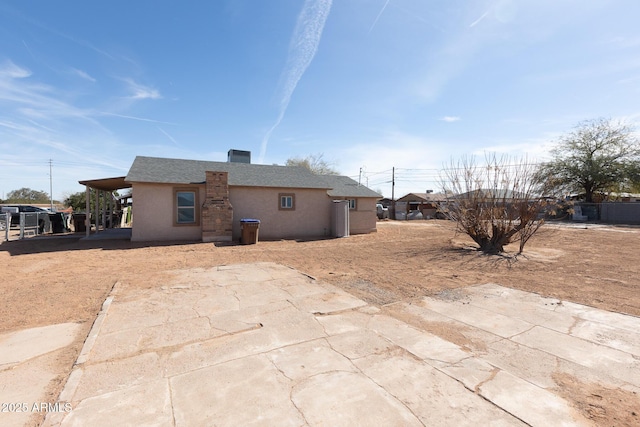 349 E Central Ave, Coolidge, AZ 85128 - rear view of house with stucco siding