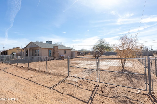 349 E Central Ave, Coolidge, AZ 85128 - view of front facade with stucco siding and fence