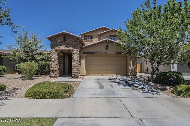 9752 E Torino Ave, Mesa, AZ 85212 - view of front facade with stucco siding, concrete driveway, stone siding, an attached garage, and a tiled roof
