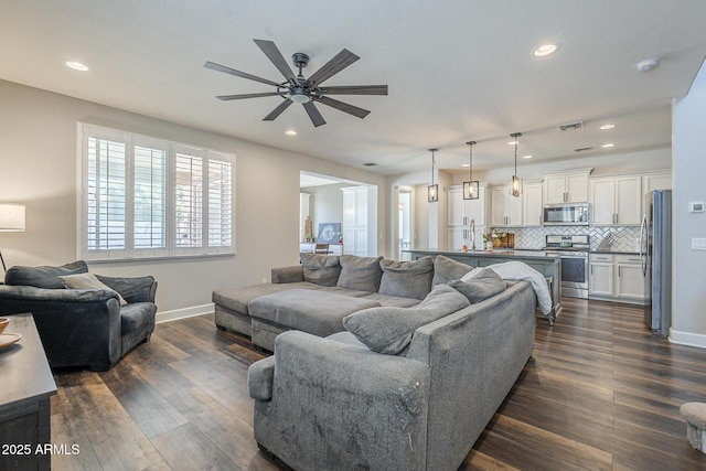 9752 E Torino Ave, Mesa, AZ 85212 - living area featuring ceiling fan, baseboards, dark wood-style floors, and recessed lighting