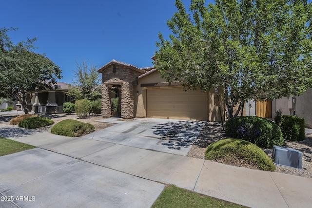 9752 E Torino Ave, Mesa, AZ 85212 - view of front of home featuring stucco siding, stone siding, an attached garage, driveway, and a tile roof