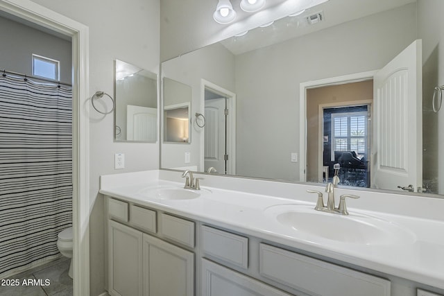 9752 E Torino Ave, Mesa, AZ 85212 - full bath featuring double vanity, toilet, tile patterned floors, and a shower with shower curtain