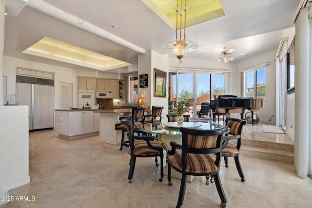 7728 E Mary Sharon Dr, Scottsdale, AZ 85266 - dining room with a raised ceiling and ceiling fan