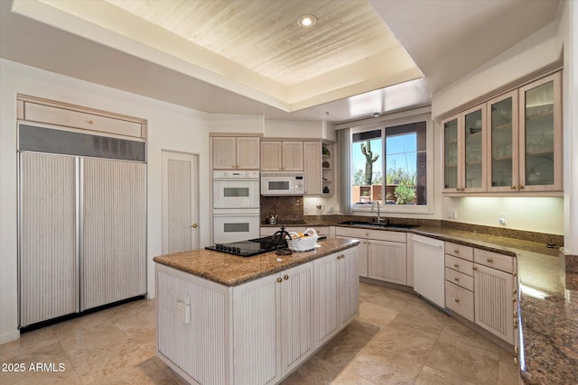 7728 E Mary Sharon Dr, Scottsdale, AZ 85266 - kitchen with a sink, white appliances, a raised ceiling, a center island, and glass insert cabinets