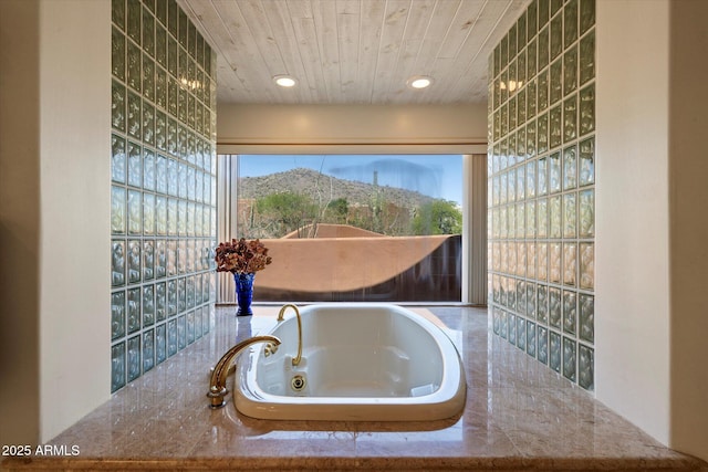 7728 E Mary Sharon Dr, Scottsdale, AZ 85266 - full bath with a tub with jets, recessed lighting, and wooden ceiling