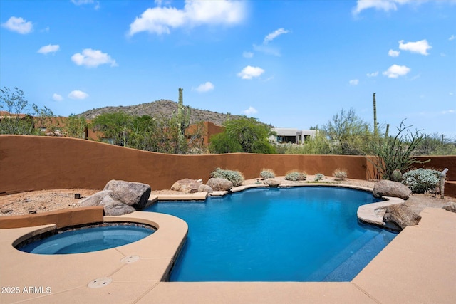 7728 E Mary Sharon Dr, Scottsdale, AZ 85266 - view of pool featuring an in-ground hot tub, a mountain view, and a fenced backyard