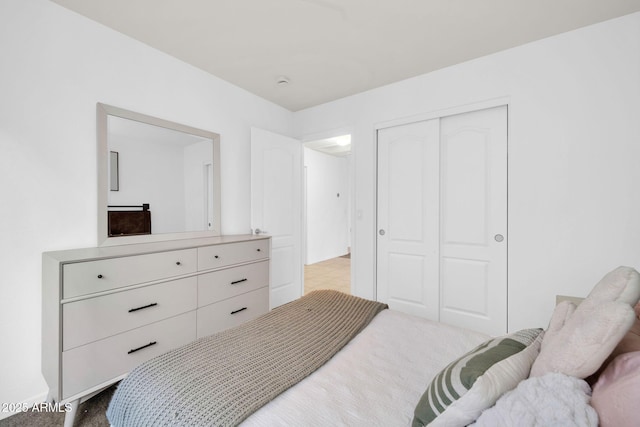 bedroom with a closet and carpet floors