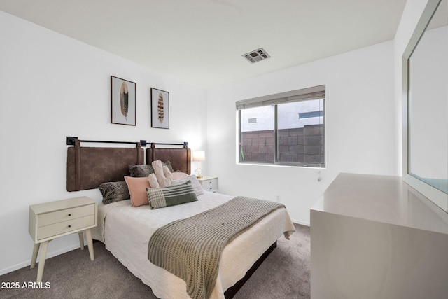 carpeted bedroom with baseboards and visible vents