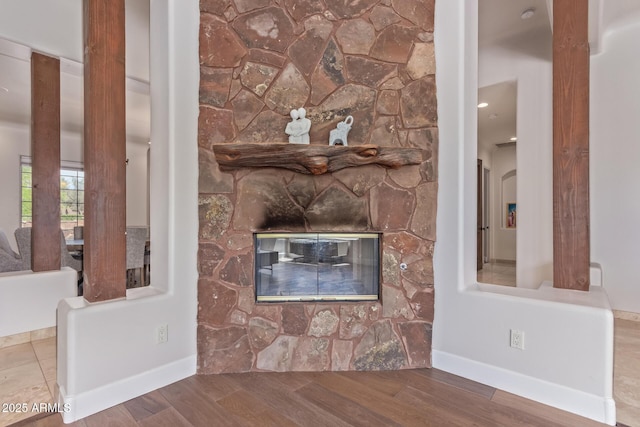 14619 E Desert Vista Trl, Scottsdale, AZ 85262 - detailed view of wood finished floors, baseboards, and a stone fireplace