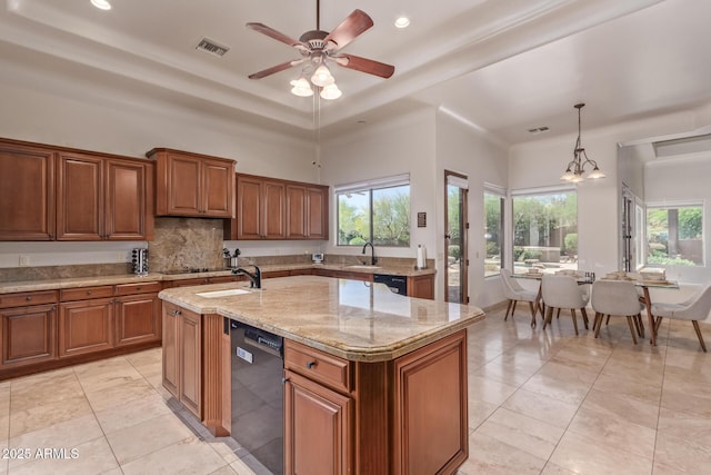 14619 E Desert Vista Trl, Scottsdale, AZ 85262 - kitchen with black appliances, a sink, brown cabinetry, an island with sink, and recessed lighting