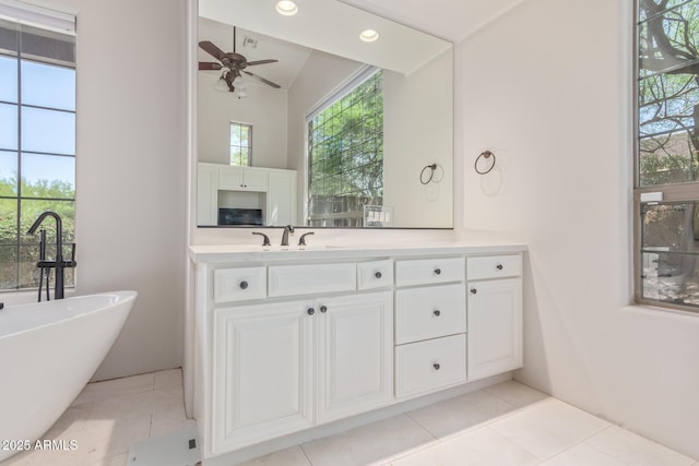 14619 E Desert Vista Trl, Scottsdale, AZ 85262 - full bath featuring a freestanding tub, vanity, ceiling fan, tile patterned floors, and lofted ceiling