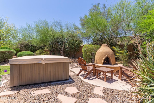 14619 E Desert Vista Trl, Scottsdale, AZ 85262 - view of patio / terrace with a hot tub and exterior fireplace