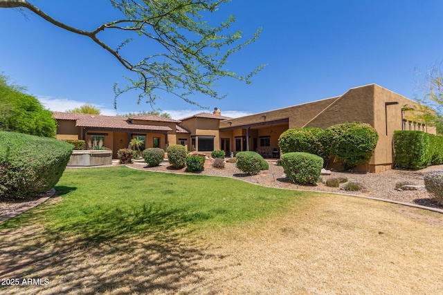 14619 E Desert Vista Trl, Scottsdale, AZ 85262 - rear view of house with a lawn, stucco siding, and a chimney