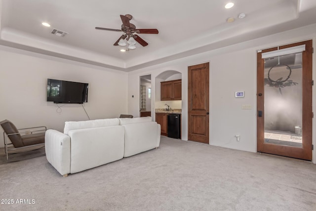 14619 E Desert Vista Trl, Scottsdale, AZ 85262 - living room featuring a raised ceiling, light colored carpet, a ceiling fan, and recessed lighting