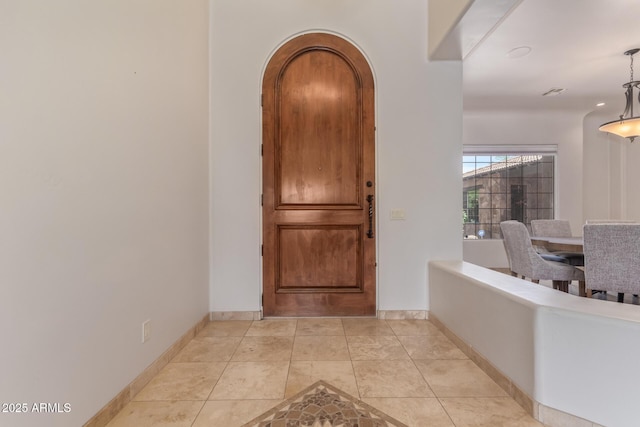 14619 E Desert Vista Trl, Scottsdale, AZ 85262 - entrance foyer with baseboards, light tile patterned flooring, and arched walkways