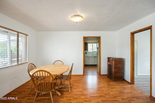 316 B St, Bisbee, AZ 85603 - dining space featuring light wood-style floors and baseboards