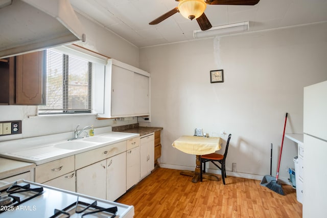 316 B St, Bisbee, AZ 85603 - kitchen featuring ceiling fan, light wood-style flooring, a sink, light countertops, and baseboards