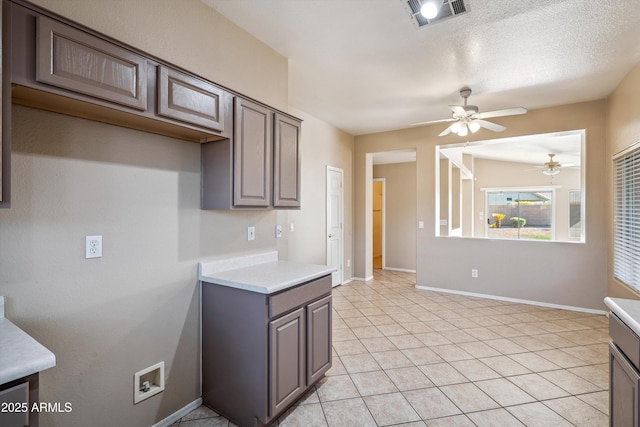 9422 W Monroe St, Peoria, AZ 85345 - kitchen featuring ceiling fan, light countertops, gray cabinets, and light tile patterned flooring