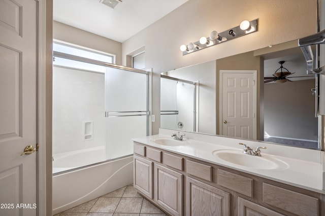 9422 W Monroe St, Peoria, AZ 85345 - bathroom with ceiling fan, double vanity, enclosed tub / shower combo, and tile patterned floors
