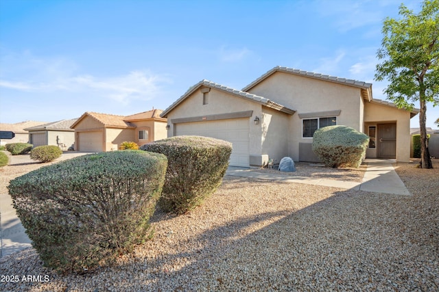 9422 W Monroe St, Peoria, AZ 85345 - view of front of home featuring an attached garage, stucco siding, and concrete driveway