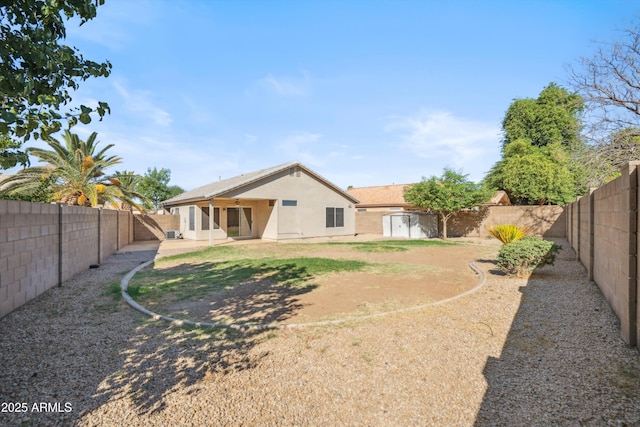 9422 W Monroe St, Peoria, AZ 85345 - rear view of property featuring a fenced backyard, stucco siding, and a patio