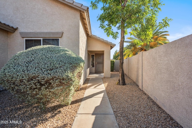 9422 W Monroe St, Peoria, AZ 85345 - view of exterior entry featuring stucco siding and a tiled roof
