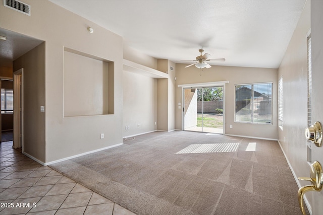 9422 W Monroe St, Peoria, AZ 85345 - carpeted empty room with a ceiling fan, tile patterned flooring, and vaulted ceiling
