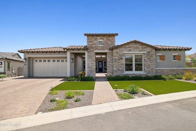 20797 W Rattler Rd, Buckeye, AZ 85396 - view of front facade with stucco siding, a garage, a tile roof, decorative driveway, and a front yard