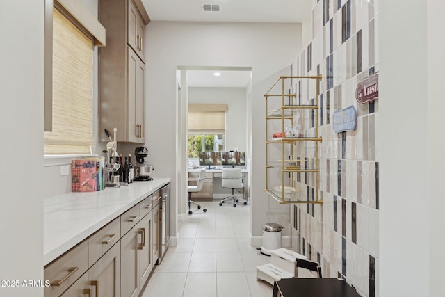 20797 W Rattler Rd, Buckeye, AZ 85396 - bar area with light tile patterned flooring and wine cooler