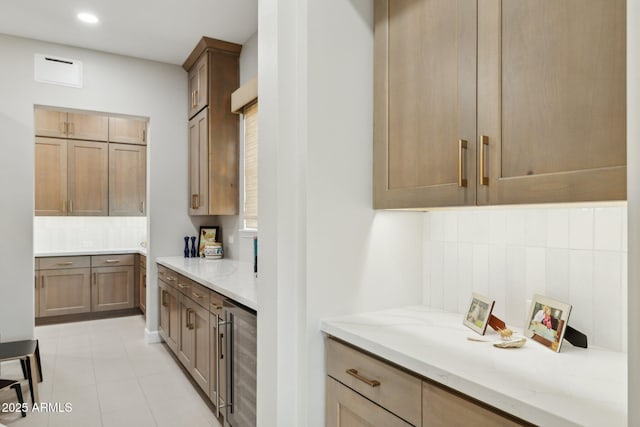 20797 W Rattler Rd, Buckeye, AZ 85396 - kitchen with beverage cooler, decorative backsplash, light stone counters, and recessed lighting
