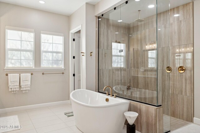20797 W Rattler Rd, Buckeye, AZ 85396 - bathroom featuring a tile shower, a freestanding bath, baseboards, tile patterned flooring, and recessed lighting