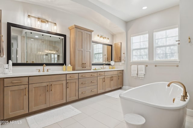 20797 W Rattler Rd, Buckeye, AZ 85396 - full bathroom with a stall shower, double vanity, a freestanding bath, tile patterned flooring, and recessed lighting