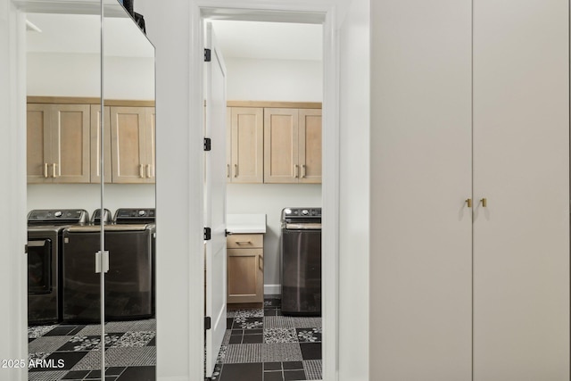 20797 W Rattler Rd, Buckeye, AZ 85396 - corridor with washer and dryer, dark tile patterned flooring, and baseboards