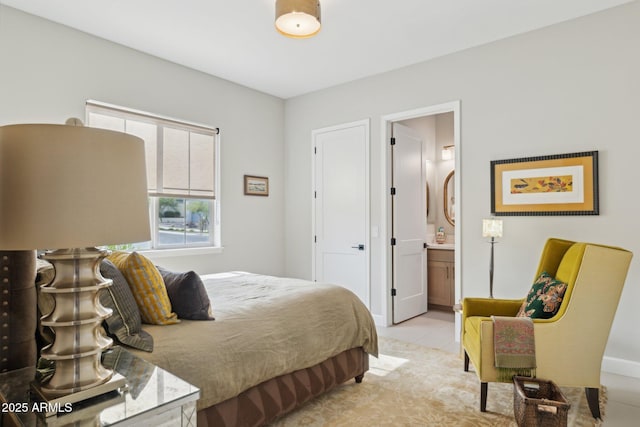 20797 W Rattler Rd, Buckeye, AZ 85396 - bedroom with ensuite bathroom, baseboards, and light tile patterned floors