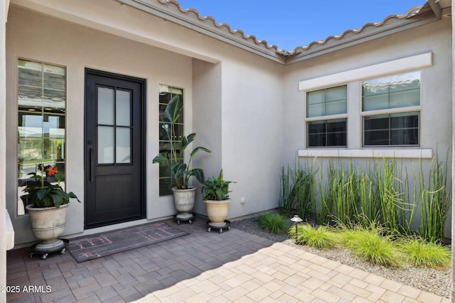 20797 W Rattler Rd, Buckeye, AZ 85396 - property entrance featuring stucco siding and a patio area